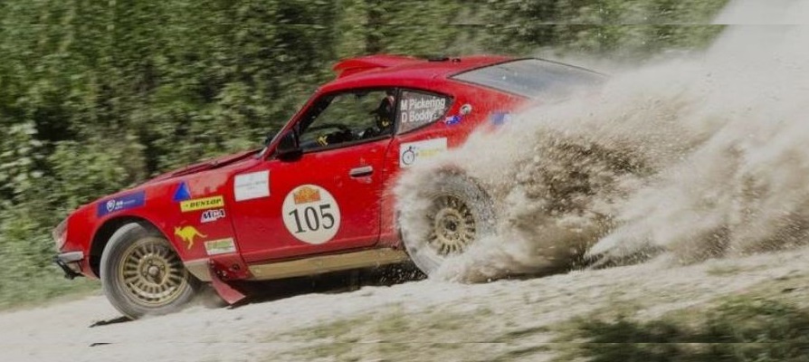 Image of rally car driving on a gravel road